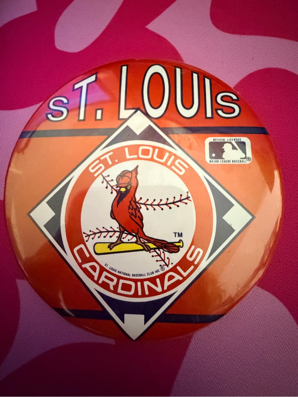 Vintage St. Louis Cardinals team logo pin featuring a "bird on the bat" design